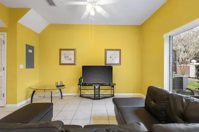 a living room with a couch and a tv at Shvck5 - Coral Cay Resort #5 - 4 Bed 3 Baths Townhome in Kissimmee