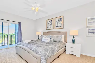 a bedroom with a bed and a window at Pet-Friendly 3BR Condo w Pool in Orlando