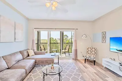 a living room with a couch and a tv at Pet-Friendly 3BR Condo w Pool in Orlando