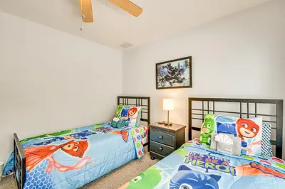 a bedroom with two beds and a night stand at 11 Mi to Disney Venetian Bay Villages Townhome! in Kissimmee