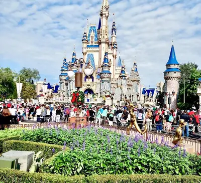 a garden in front of a disney castle at Happy Place in Orlando