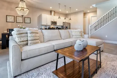 a living room with a couch and a table at 5 BR 6 BA Villa 5min to Disney! SMV154 in Orlando