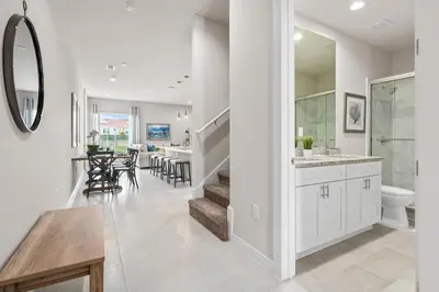 a kitchen and living room with a sink and a toilet at Comfortable home w 3 En-suites! SMV157 in Orlando
