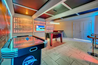 a games room with a ping pong table at 9 BR Family Home 8 Minutes to Disney STL119 in Kissimmee