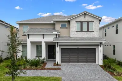 a house with a garage at Stunning Modern Home VPR102 in Kissimmee
