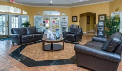 a lobby with couches and a table in a store at A Peaceful Orlando Escape, nature, comfort & Disney Nearby EMI101 in Kissimmee