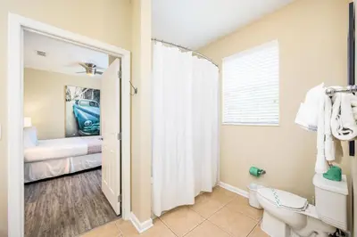 a bathroom with a shower and a toilet in a room at Epic Universe New Beautiful Condo, Vista Cay, Orlando - 3011 in Orlando