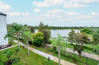 a view of a lake from a house at Epic Universe Beautiful Lakeview Condo, Vista Cay Orlando - 3013 in Orlando