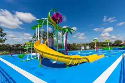 a playground with a slide in a swimming pool at WH7820BS - 5 bedrooms - Pool - Theater - Resort in Orlando