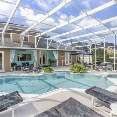 Mickeys Oyster - Luxurious 9BR Southeast Facing Pool Hot Tub Cinema Game RM BBQ 2 miles to Disney