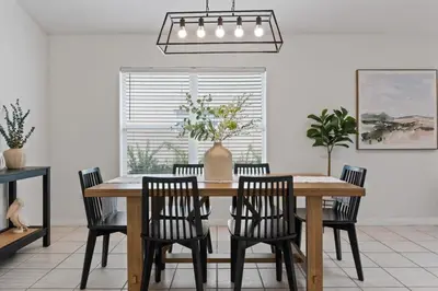 a dining room with a wooden table and chairs at Indian Ridge - Pool Home with Spa, Newly Renovated in Orlando