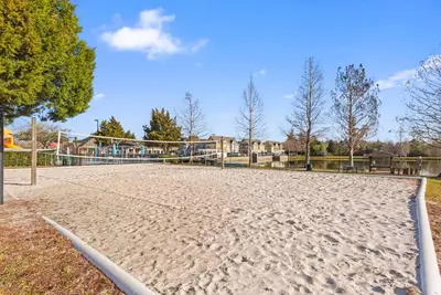 a volleyball court with a net in a park at The Villas at Seven Dwarfs - 2603 Amazing Luxury Villa - Near Disney - Water Park in Kissimmee