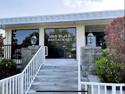 a sign on the front of the house restaurant at Stunning Ventura Condo in Orlando
