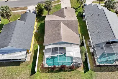 an overhead view of a house with a swimming pool at Minutes from Disney - Entertainment Haven with Pool in Orlando