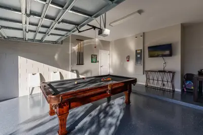 a room with a pool table in a room with a wall at Beautiful and cozy home at Sonoma Resort in Kissimmee