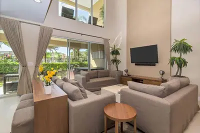a living room with couches and a flat screen tv at wish home disney (45437492) in Orlando