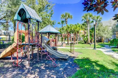 a playground in a park with a slide at Cozy Escape - Disney Universal SeaWorld in Orlando