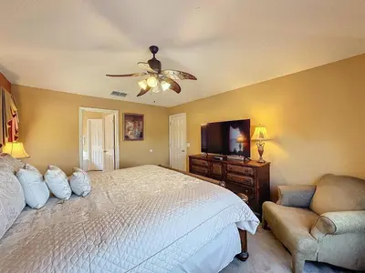 a bedroom with a bed and a ceiling fan at Four Bed in Emerald Island Resort mins to Disney in Kissimmee