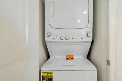 a white washer and dryer in a room at 3120 Paradox Circle 104 in Kissimmee