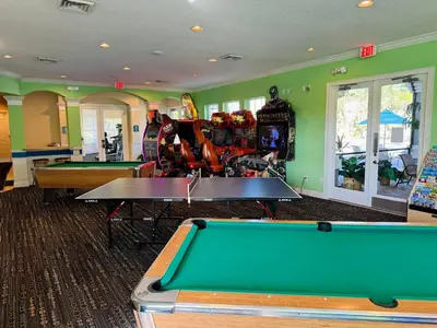 a billiard room with two ping pong tables at 4 bed Single Level Home in Windsor Palms Sleeps 8 in Kissimmee