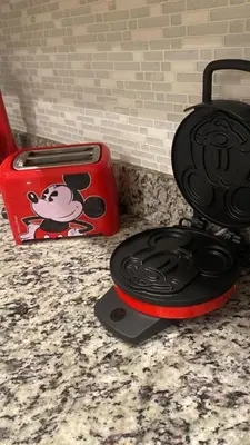 a red toaster sitting on a counter next to a box at 4br Disney Retreat Gated Resort with Pool & Hot Tub in Orlando