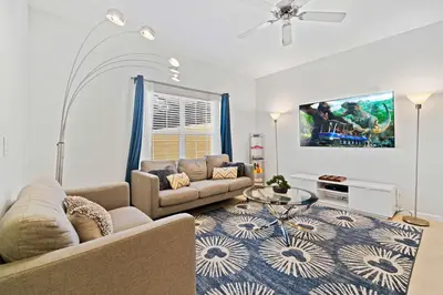 a living room with a couch and a table at 8953 Candy Palm Road in Kissimmee
