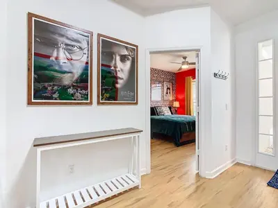 a living room with two pictures on the wall at Single Level 2 KING BEDS - 4BedrmPOOL-SPA-Disney in Orlando