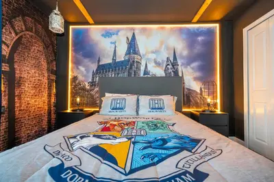 a bedroom with a hogwarts mural on the wall at Gorgeous 4Bd with Pool and Waterpark at Storey Lake 4836M in Kissimmee