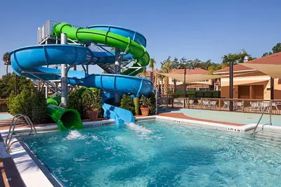 a water slide in a pool at a resort at 2711 - Jungle Book Bungalow - DO NOT DO in Orlando