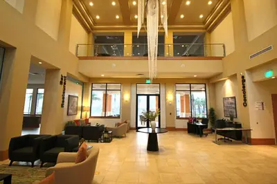 a lobby with couches and chairs in a building at 2711 - Jungle Book Bungalow - DO NOT DO in Orlando