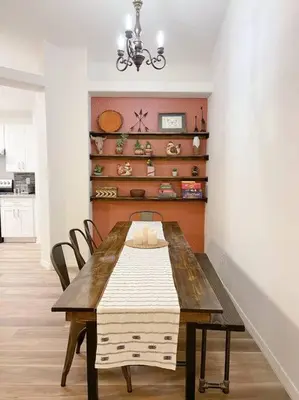 a dining room with a wooden table and chairs at The Sanford Ave House with fully fenced yard in Sanford