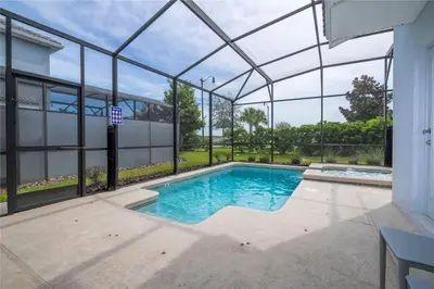 a swimming pool in a building with a glass roof at Amazing home at Storey lake 2 minutes to clubhouse in Kissimmee
