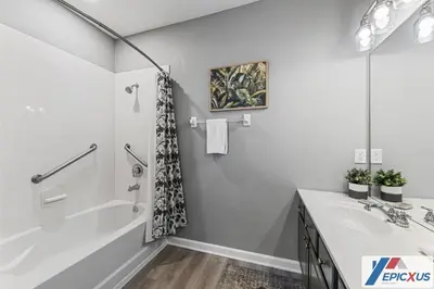 a bathroom with a tub and a sink at The Epic Colorado Vista Cay Orlando in Orlando