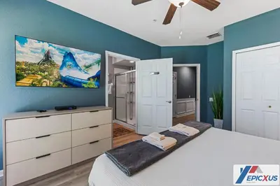 a bedroom with a bed and a painting on the wall at The Epic Colorado Vista Cay Orlando in Orlando