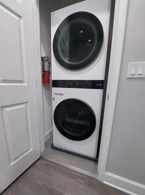 a washer and dryer in a room at Serenity Close to Disney Orlando in Orlando