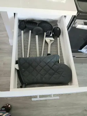 a white drawer with some tools in it at Nard Jolie Kay in Kissimmee