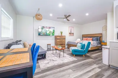 a living room with a bed and a couch at NEW Designed Apt 2023 NrUCF PETSOk PrivateEntry in Orlando