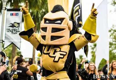 a person dressed in a yellow football mascot at NEW Designed Apt 2023 NrUCF PETSOk PrivateEntry in Orlando