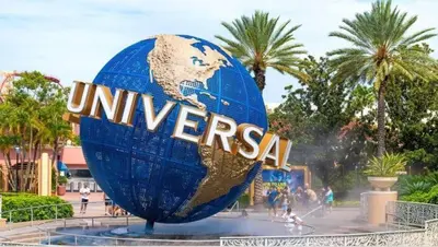 a large blue sign that reads universal studios at NEW Designed Apt 2023 NrUCF PETSOk PrivateEntry in Orlando