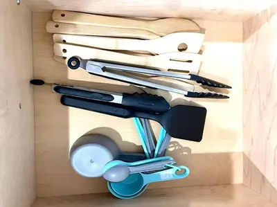 a drawer with a bunch of kitchen utensils at NEW5 LUXURYSTUDIO Nr DISNEY PETSOKprivENTRY in Kissimmee
