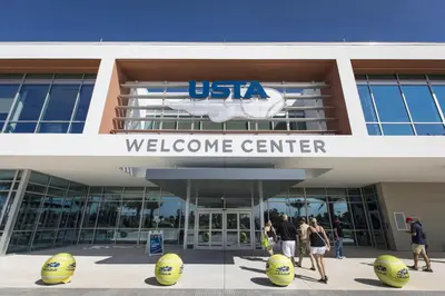 people walking outside a usa welcome center at BRANDNEW 2023 LAKEFRONT APT in Kissimmee