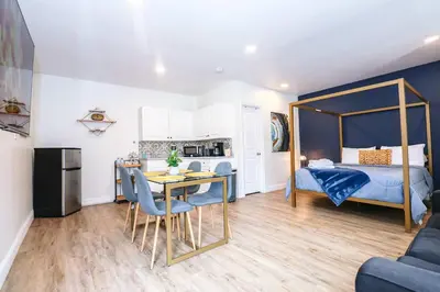 a bedroom with a bed and a table and chairs at NEW5 APT NrUCF PETSOK PRIVATE patioENTRY LAUNDRY in Orlando