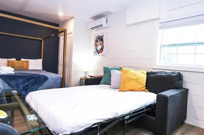 a small room with two beds and a window at NEW5 APT NrUCF PETSOK PRIVATE patioENTRY LAUNDRY in Orlando