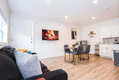 a living room with a couch and a table at NEW5 APT NrUCF PETSOK PRIVATE patioENTRY LAUNDRY in Orlando