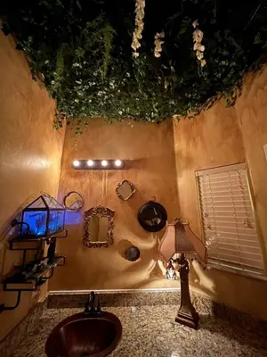 a bathroom with a sink and a toilet and a window at Magical Themed Home, Potter, Peter Pan 3mi Disney in Kissimmee