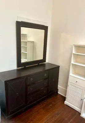 a black dresser with a mirror on top of it at Renovated Peaceful Luxury Walk to Mall Park Publix in Orlando