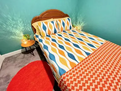 a bedroom with a bed in a room at The Sanford Bandstand in Sanford