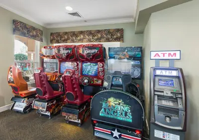 a bunch of arcade games in a room at Wonderful Life at Windsor Hills in Orlando
