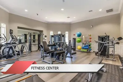 a fitness center with treadmills and exercise machines at Harry Potter-Themed, Lake View, Spacious Condo Near Universal with Extra Amenities in Orlando