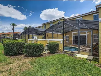an exterior view of a house with a swimming pool at Island Abode -near Disney in Kissimmee